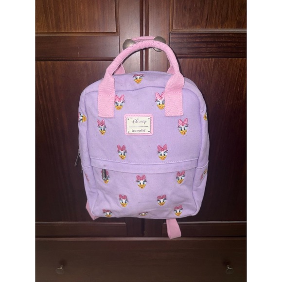 Loungefly Handbags - Loungefly Disney Daisy Duck AOP Sensational 6 Canvas Mini Backpack